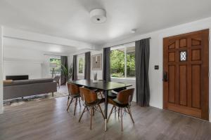 a dining room with a table and chairs and a door at Blueground Beacon Hill nr groceries parks SEA-702 in Seattle