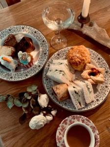 a table with two plates of food and a cup of coffee at The Aberlour Hotel in Aberlour