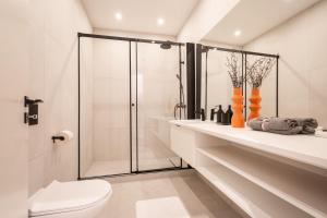 a bathroom with a shower and a toilet at A13- Deluxe Apartments, Best Location, by BQA in Budapest