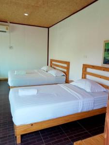เตียงในห้องที่ Suannamphukradueng &Suansook Resort