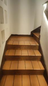 a set of wooden stairs in a room at Sôsouza in Belo Horizonte
