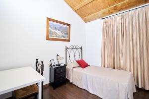 Postel nebo postele na pokoji v ubytování El Mirador del Valle + 23 fotografií