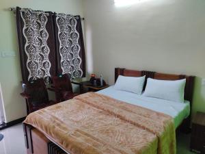 Cama o camas de una habitación en Velan Home Stay