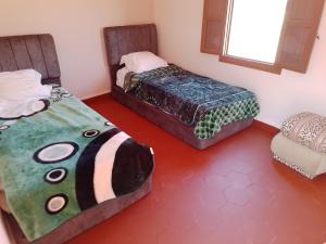 Postel nebo postele na pokoji v ubytování Tagtout