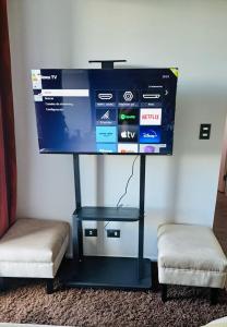 Et tv og/eller underholdning på Depto. con Vista al Volcan