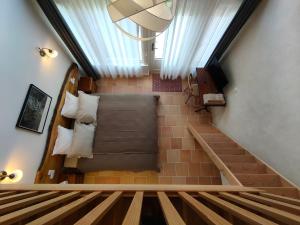 a view from the top of a stairs with a bed at Chambres d'hôtes, Zimmer, Domaine de Kervennec in Carhaix-Plouguer