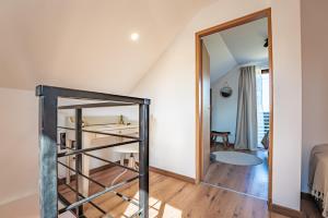 a staircase in a room with a mirror at Holiday home Villa Antique in Bjelovar +35 photos