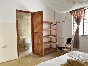 Postel nebo postele na pokoji v ubytování Mlango Paje House II
