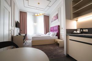 Postel nebo postele na pokoji v ubytování Boutique Hotel Ambiente ****+