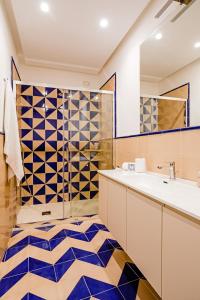 a bathroom with a tub and a sink and a mirror at Hotel Da Raffaele in Ischia