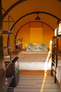 a bedroom with a large bed in a room at Nirvana Retreat in Ras al Khaimah