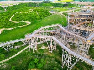 an overhead view of a bridge in a park at Slow River Apartment in Nowe Miasto Lubawskie