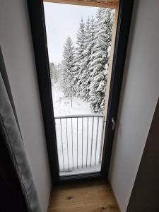 Benecko moderní apartmán A30 by AlkaTravel v zime