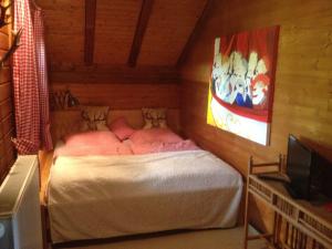 a bedroom with a bed in a room at Ferienhaus Zur Einberger Schweiz in Rödental