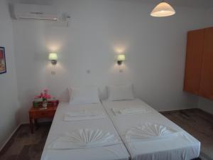 Posteľ alebo postele v izbe v ubytovaní Amfi Apartments
