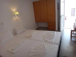Posteľ alebo postele v izbe v ubytovaní Amfi Apartments