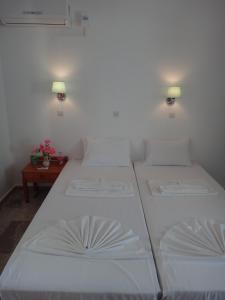Posteľ alebo postele v izbe v ubytovaní Amfi Apartments