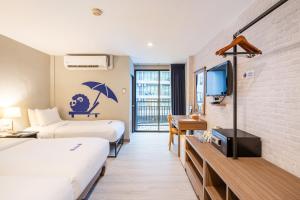 Postel nebo postele na pokoji v ubytování Kokotel Krabi Ao Nang