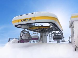 a ski lift with snow on top of it at Hotel Červenohorské sedlo in Loučná nad Desnou