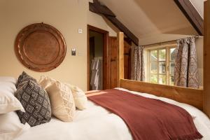 a bedroom with a large bed and a window at Castle Inn in Lydford