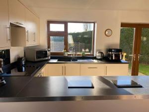 a kitchen with a sink and a counter top at The Barn in Haxby