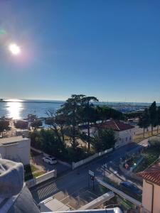 a view of the ocean from the balcony of a building at Apartments Villa Nona in Umag