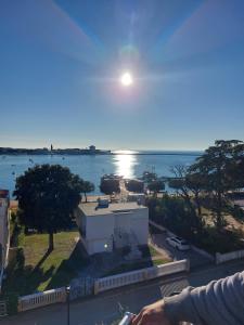 a view of the ocean from a balcony of a building at Apartments Villa Nona in Umag