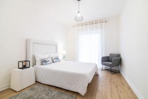 Postel nebo postele na pokoji v ubytování Green Island City Apartment