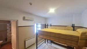 Postel nebo postele na pokoji v ubytování ALBERGUE LA TIÑOSA