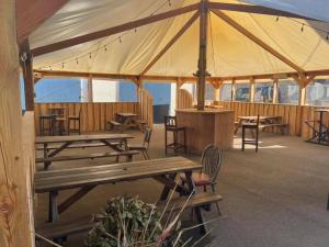 a pavilion with tables and chairs and a tent at The Aberlour Hotel in Aberlour