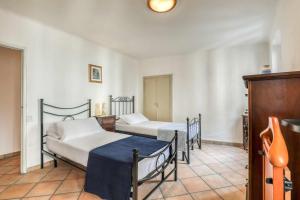 a room with two beds and a table in it at San Marco Casa Vacanza in Osimo