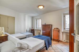 Postel nebo postele na pokoji v ubytování San Marco - Casa Casoni + 4 fotografie