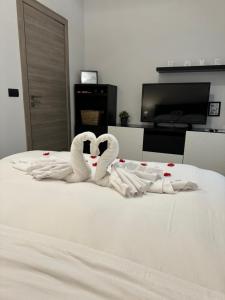 Tempat tidur dalam kamar di Mavis Apartment - To Rome with Love