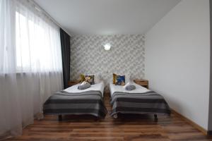 Postel nebo postele na pokoji v ubytování Noclegi Bytom - OPAL