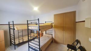 Postel nebo postele na pokoji v ubytování ALBERGUE LA TIÑOSA