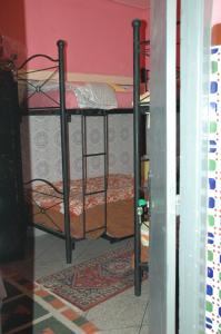 Ένα ή περισσότερα κρεβάτια σε δωμάτιο στο kech hostel