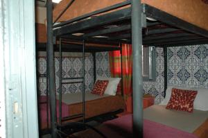 Ένα ή περισσότερα κρεβάτια σε δωμάτιο στο kech hostel