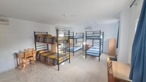 Postel nebo postele na pokoji v ubytování ALBERGUE LA TIÑOSA