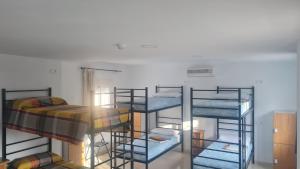Postel nebo postele na pokoji v ubytování ALBERGUE LA TIÑOSA