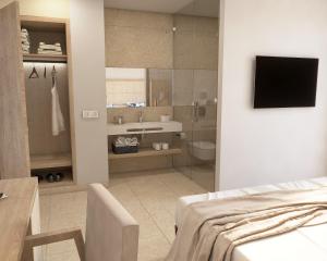 Telewizja i/lub zestaw kina domowego w obiekcie Hotel Anibal - AB Group