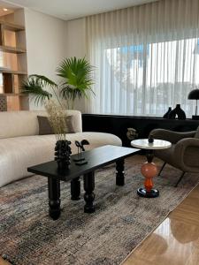 a living room with a couch and a coffee table at Misk Villa - Boutique Hotel & Spa in Sidi Bou Saïd