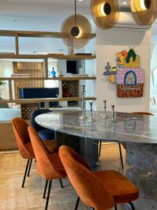 a dining room with a table and chairs at Misk Villa - Boutique Hotel & Spa in Sidi Bou Saïd