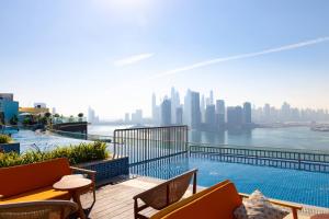 a balcony with a view of a city skyline at Cosy Studio at Palm Jumeirah in Dubai
