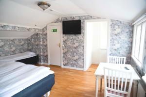 Voodi või voodid majutusasutuse Hotell Vaxblekaregården toas