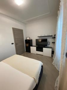 Tempat tidur dalam kamar di Mavis Apartment - To Rome with Love