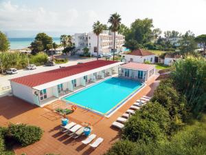 an aerial view of a house with a swimming pool at Cavomarina Beach- Adults Only in Kavos