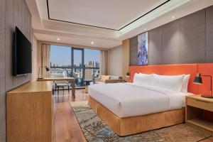 TV a/nebo společenská místnost v ubytování Hilton Garden Inn Wuhan Hankou