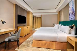 TV a/nebo společenská místnost v ubytování Hilton Garden Inn Wuhan Hankou