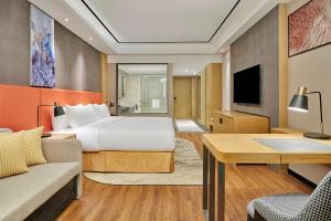 TV a/nebo společenská místnost v ubytování Hilton Garden Inn Wuhan Hankou