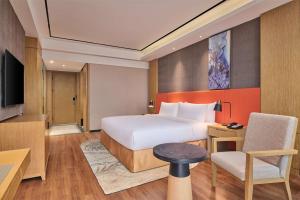 TV a/nebo společenská místnost v ubytování Hilton Garden Inn Wuhan Hankou
